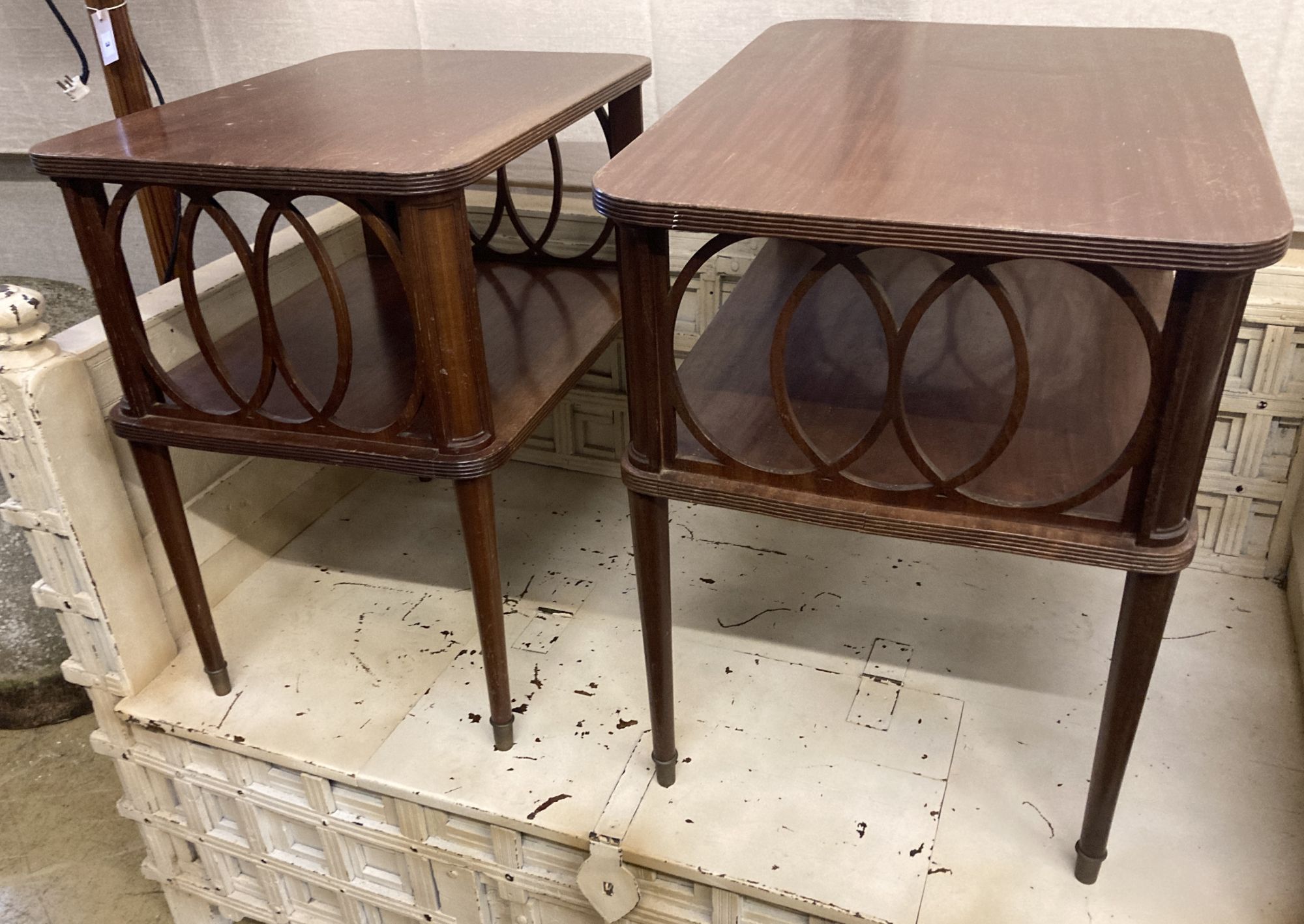 A near pair of mahogany two tier occasional tables, width 65cm, depth 49cm, height 66cm